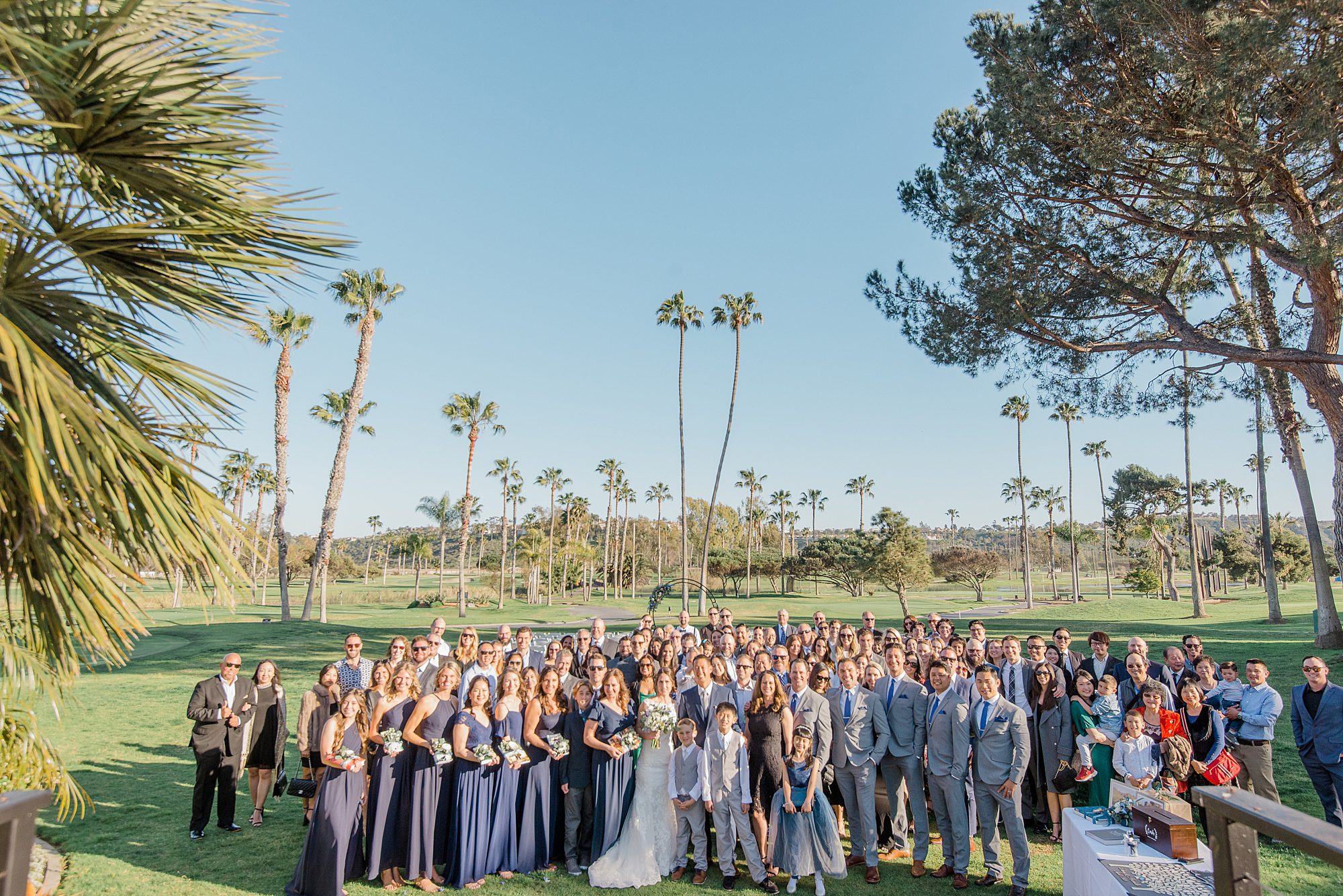 bride and groom take picture with all their wedding guests from their Elegant Morgan Run Club & Resort Wedding