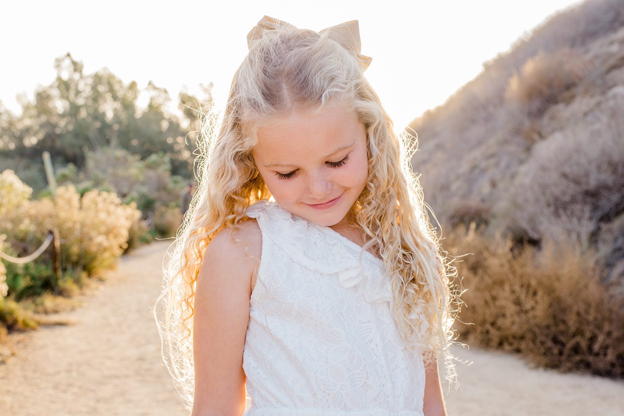 portrait of little girl in white dress during Carlsbad Sunset Family Session