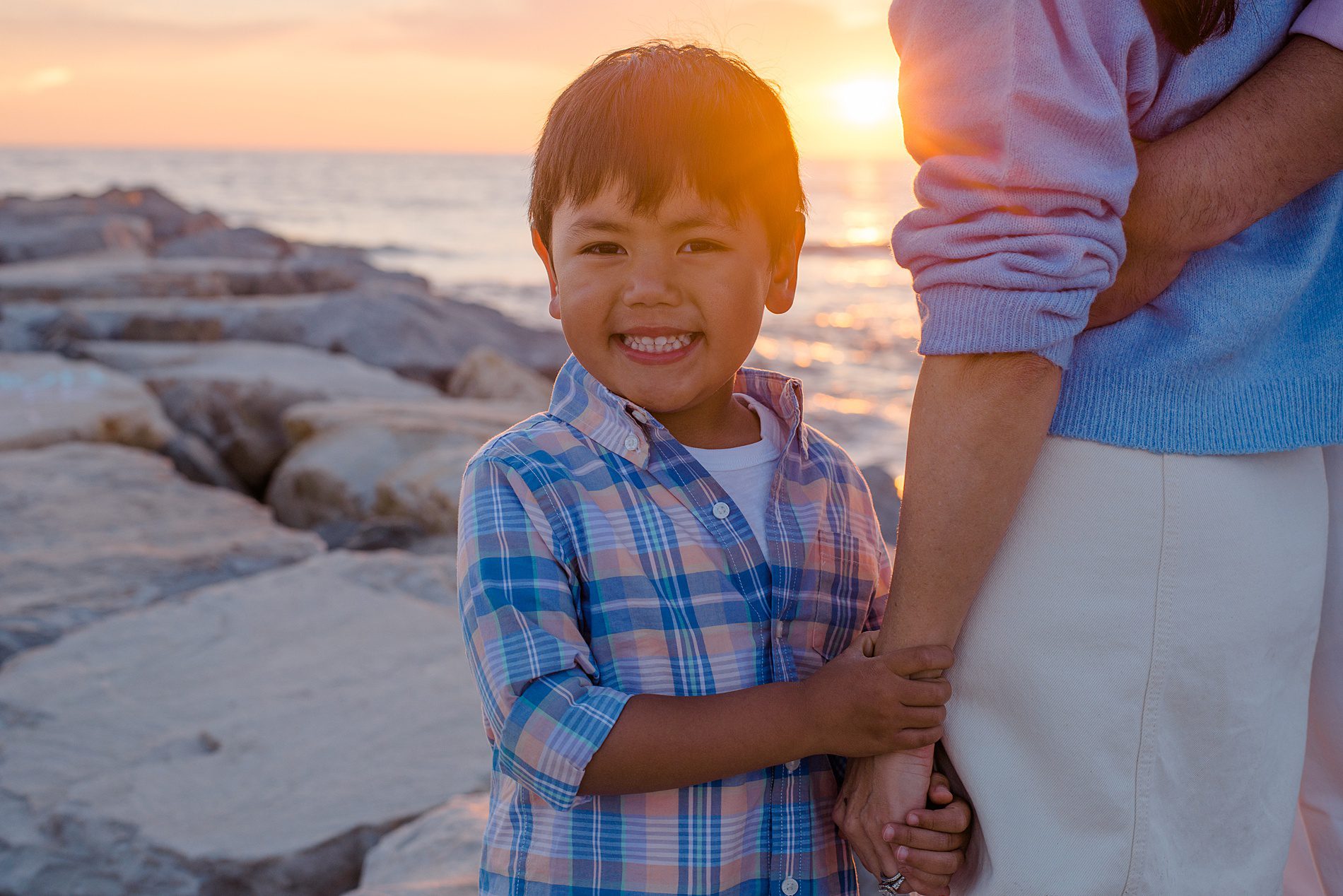 little boy smiles during Coastal Family Portraits in Carlsbad California 