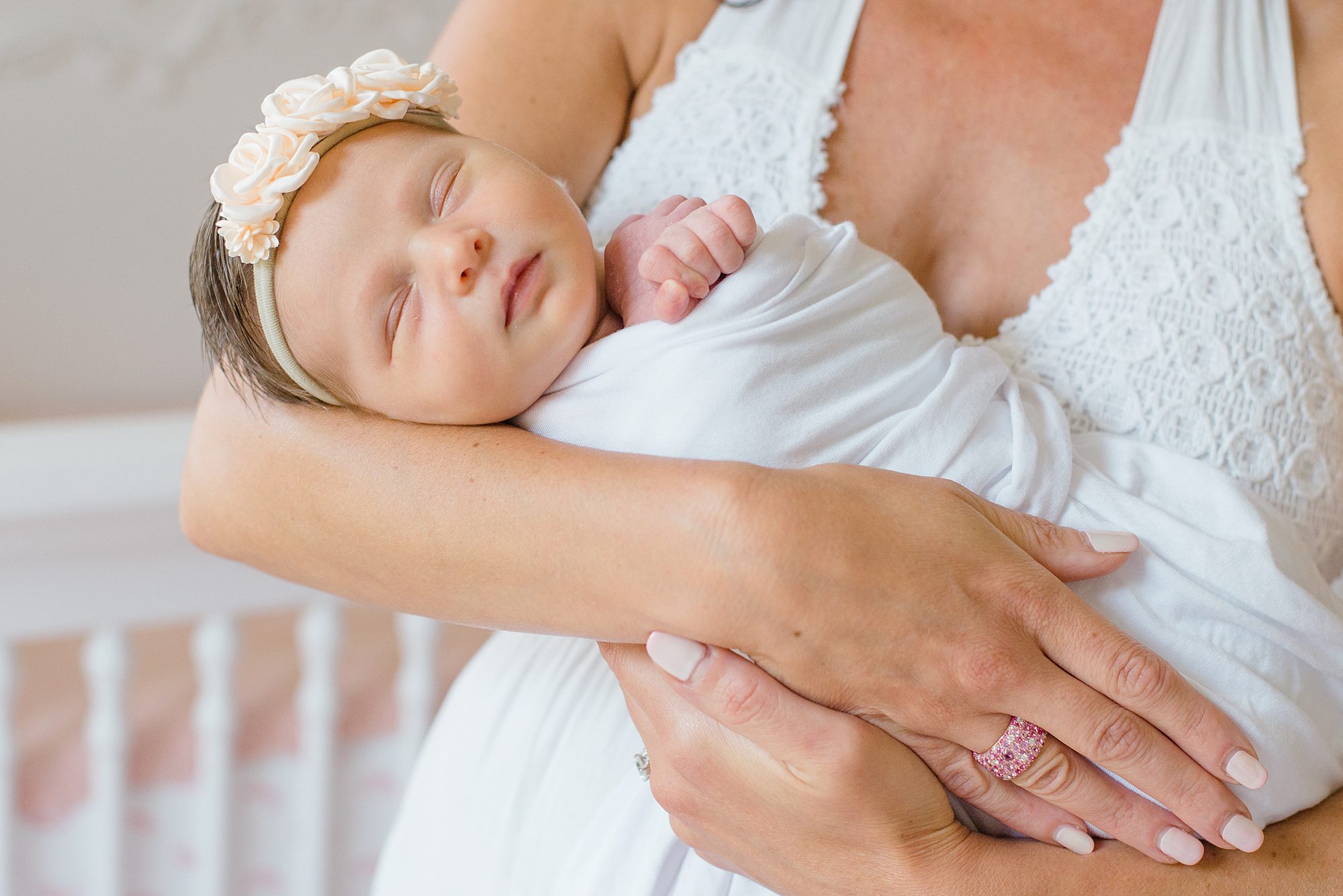 Timeless Newborn Portraits of baby girl in mom's arms 