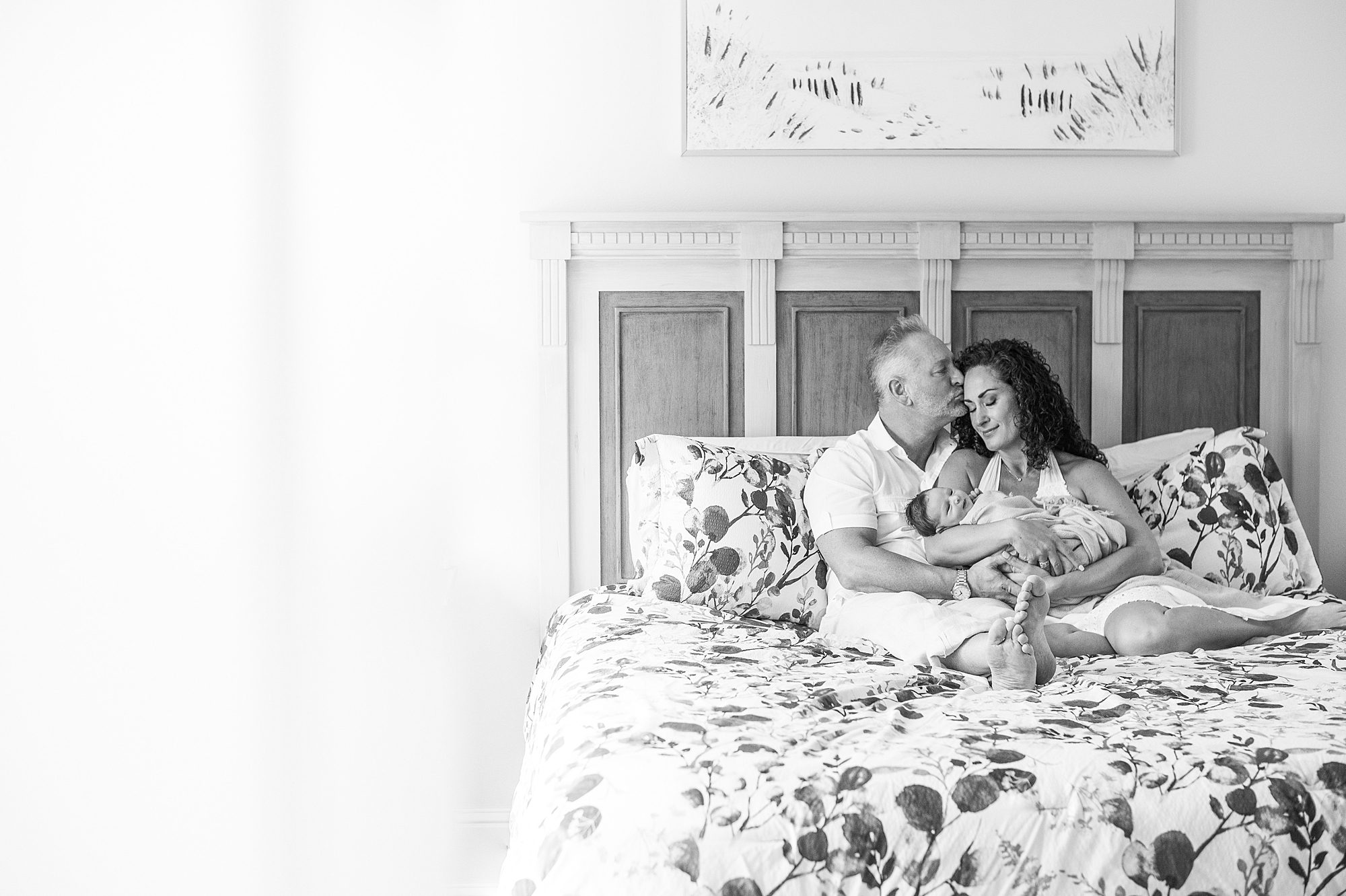 Timeless family Portraits of parents holding newborn