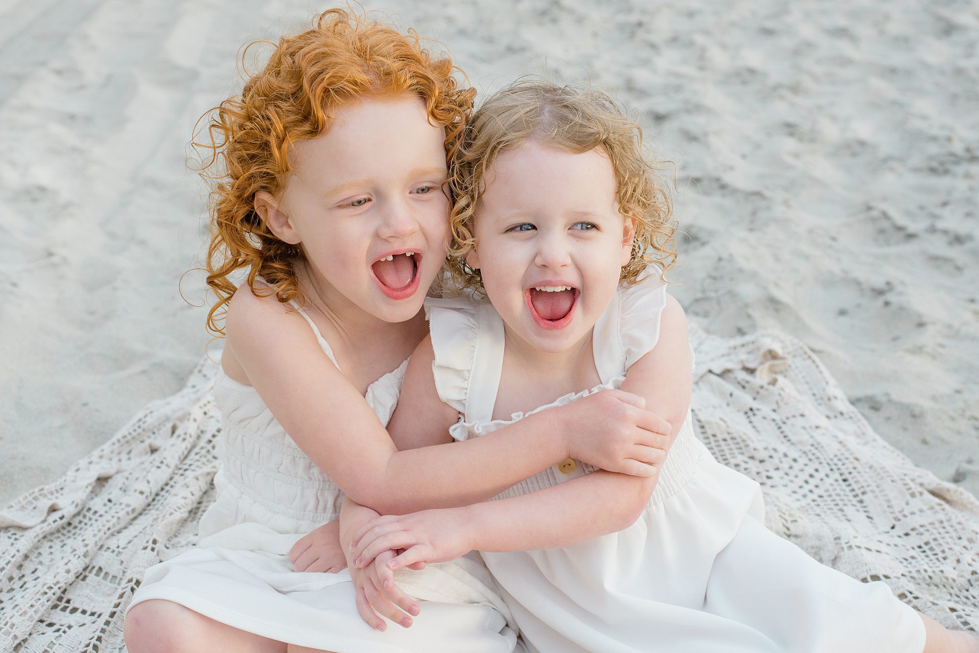 adorable sister portraits on the beach