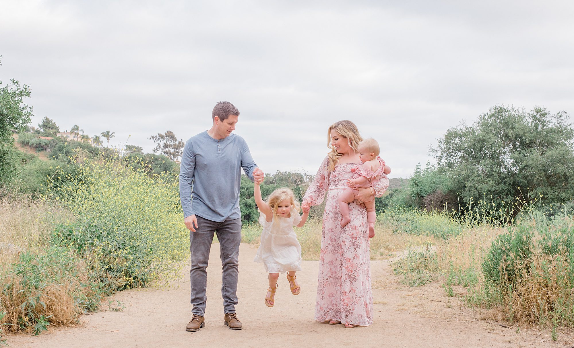 candid portraits of family of four from North County San Diego Family Session