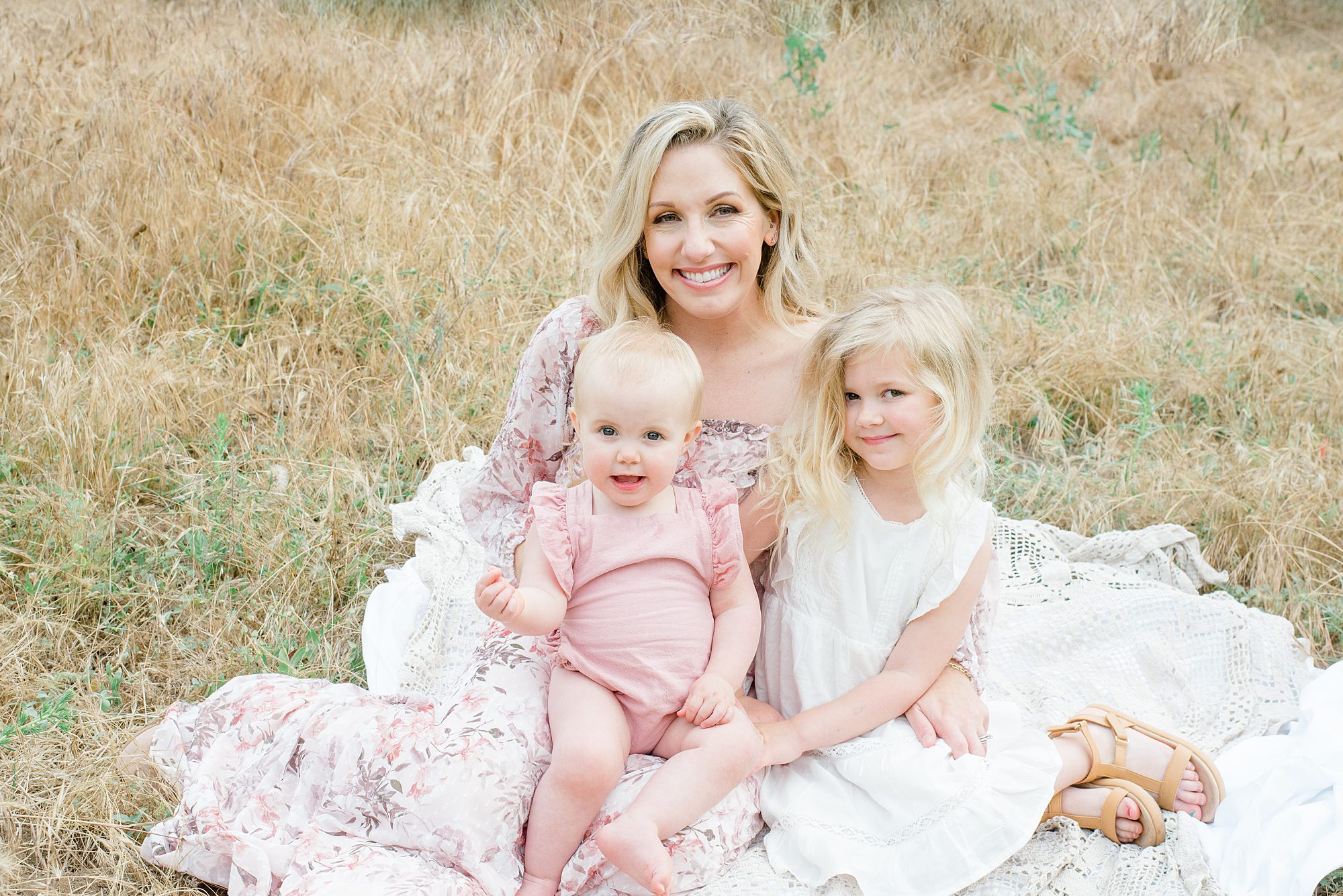 mom sits with her two daughters during North County San Diego Family Session