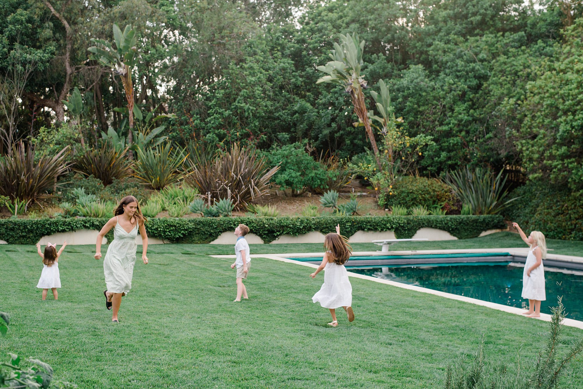 children play in the yard of Rancho Santa Fe, California home