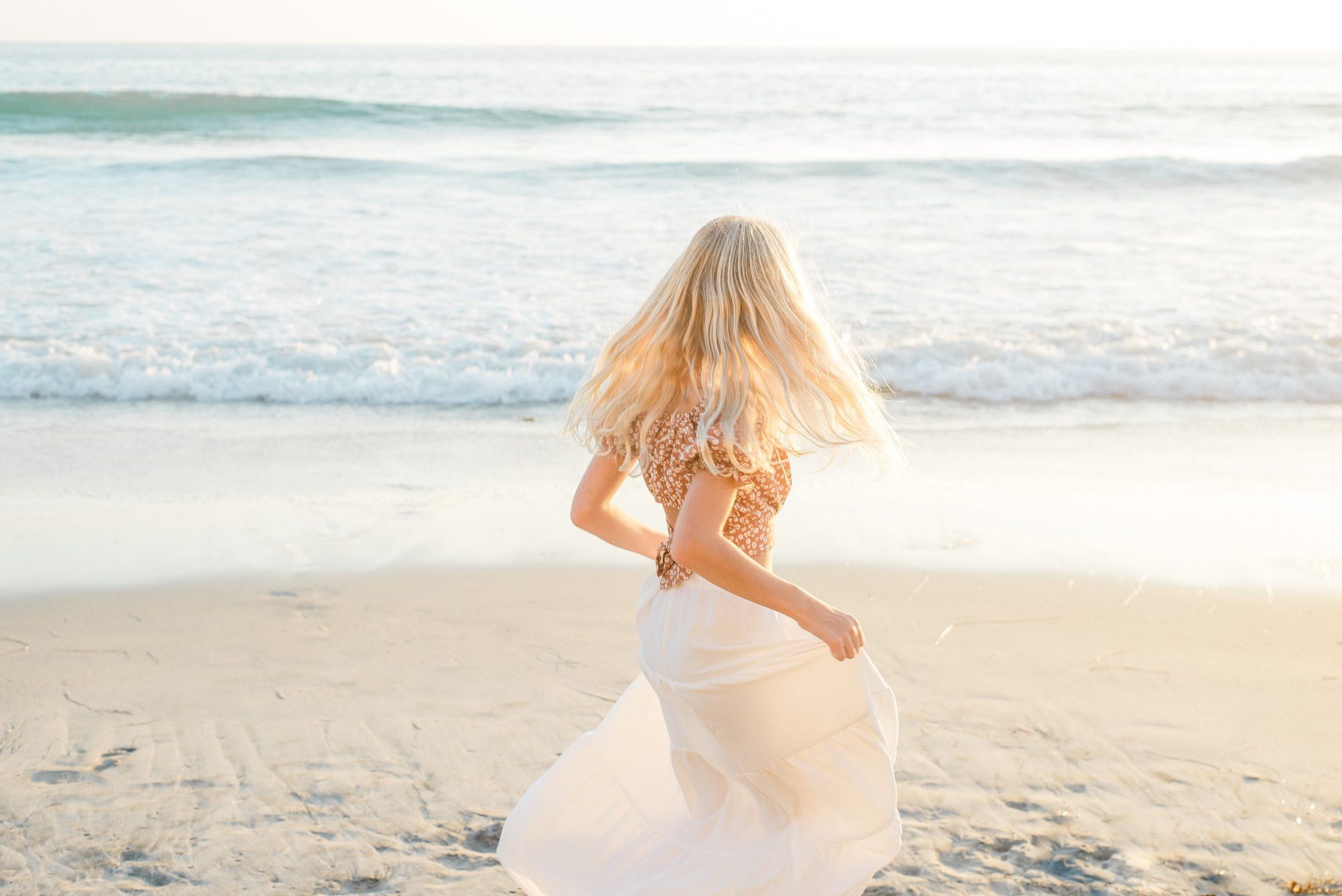 girl dances on the beach 