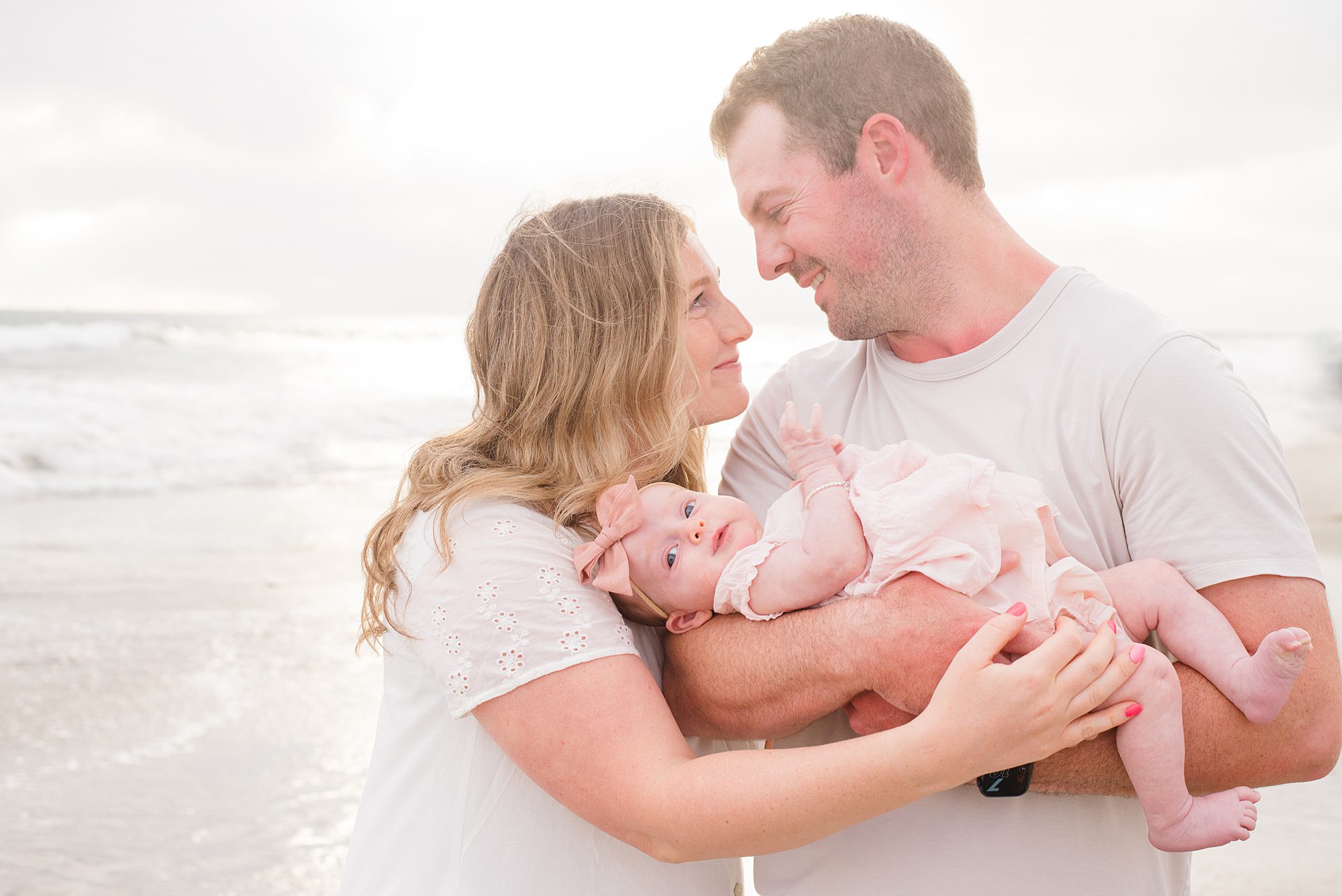 family of three during Extended Family Sunset Session in Oceanside, CA 