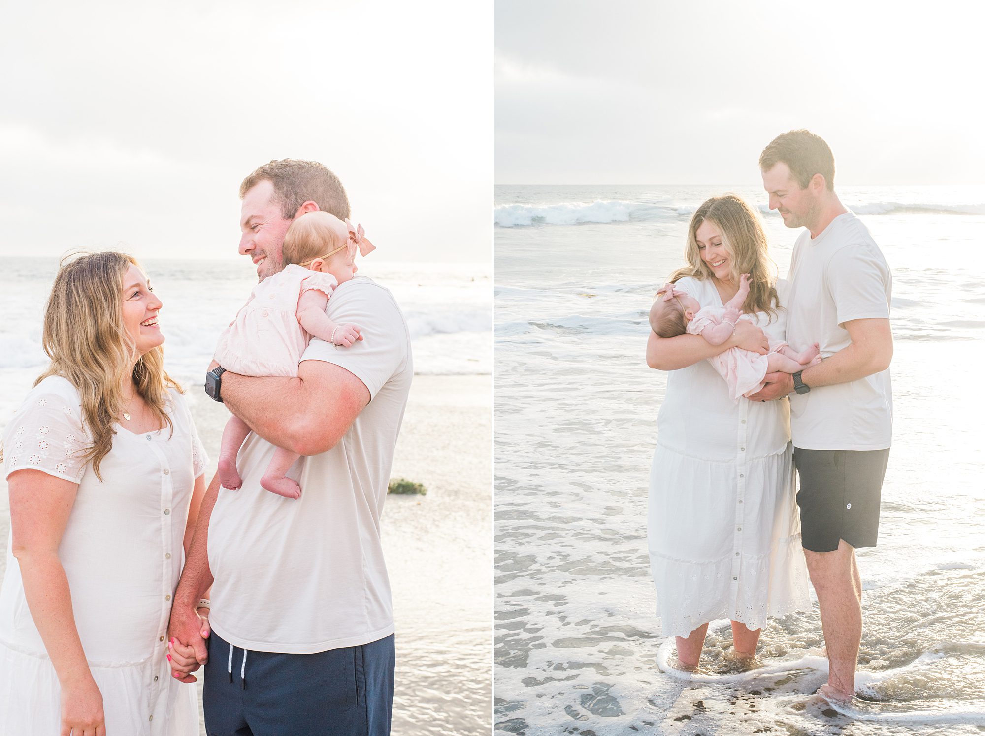 couple hold baby girl standing in the shallow ocean waves at Oceanside, CA
