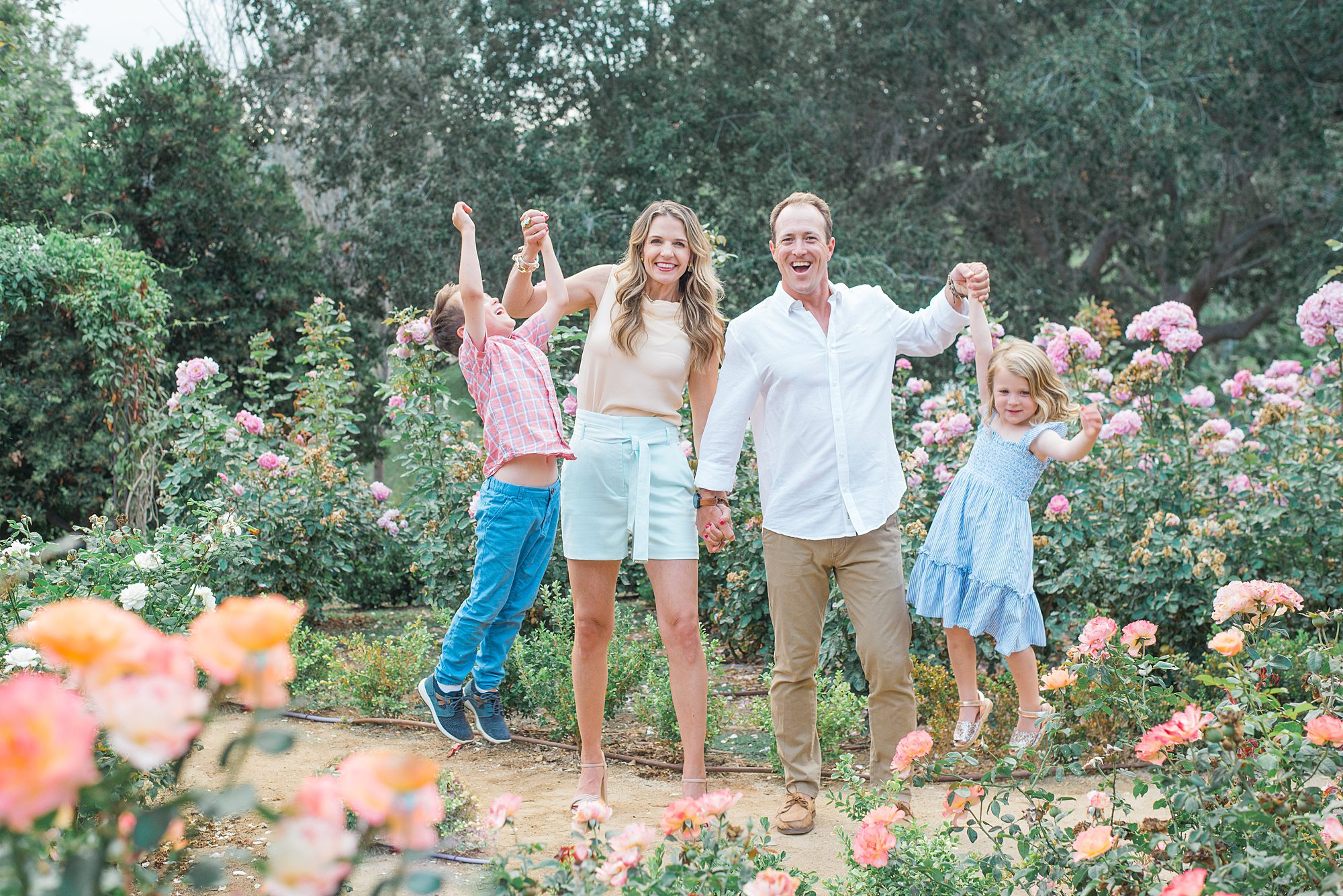 candid family portraits in rose garden