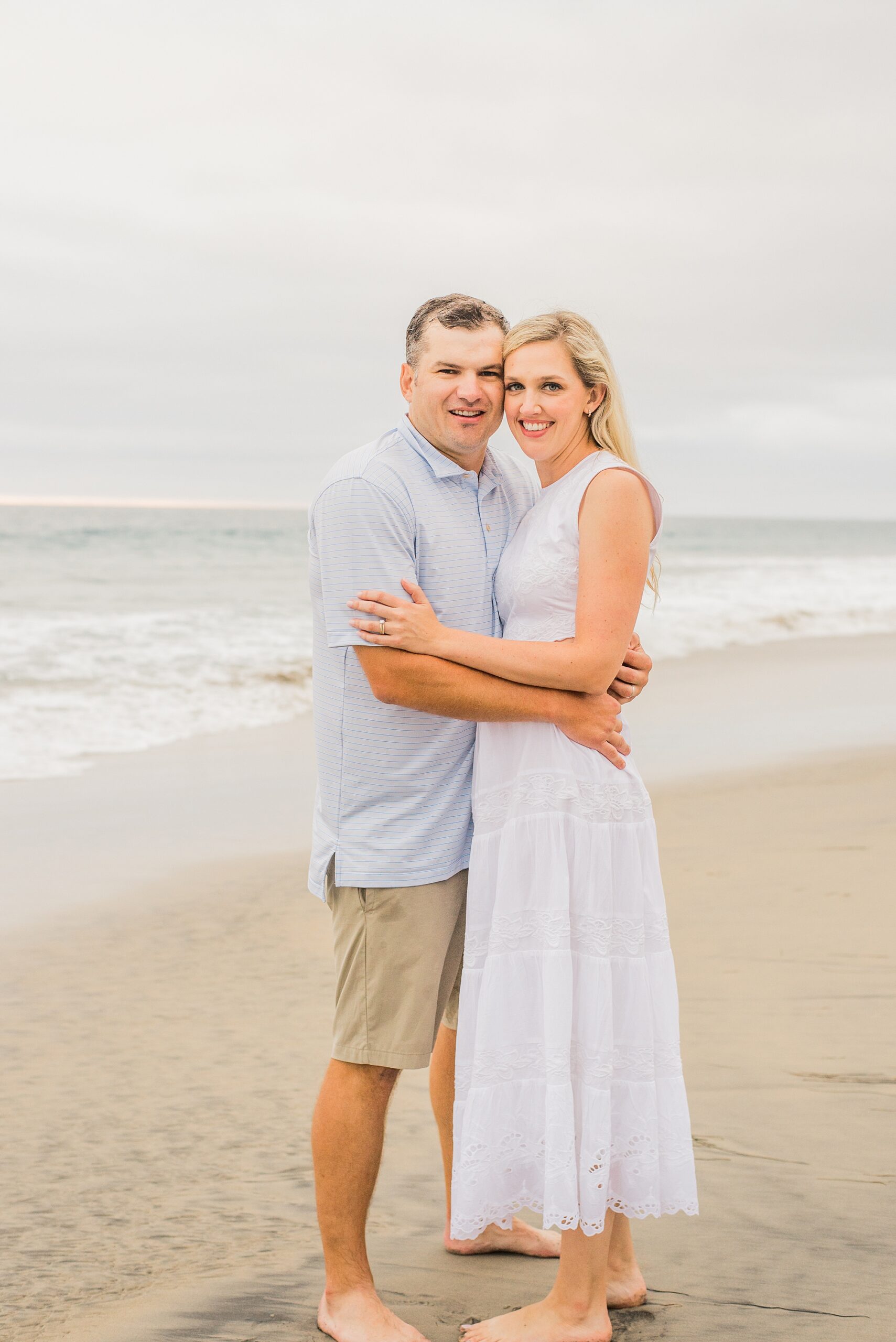 parents hug during Del Mar Beach Family Session